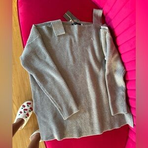 Brand new sweater that’s off the shoulder in gray.